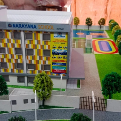 School scale model with classrooms and playground